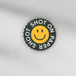 Shot on paper shoot text lens covers with yellow smiley face graphic with grip groves 